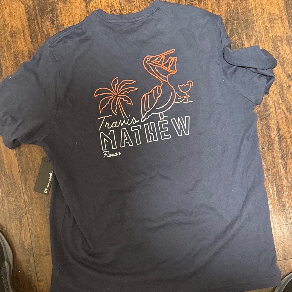 Travis Mathew Dark Blue Tee with Pelican Design